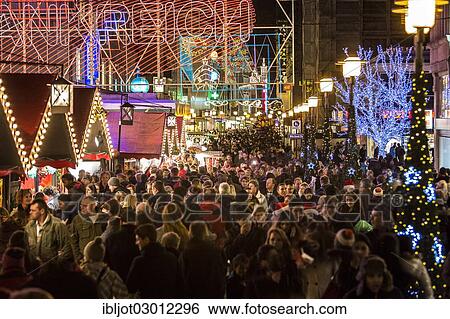 "Crowds thronging between stores and Christmas market stalls, pedestrian street in the centre of Essen, view from Willy-Brandt-Platz towards Kettwiger Strasse, Essen, North Rhine-Westphalia, Germany, Europe" View Large Photo Image Stock Photograph - "Crowds thronging between stores and Christmas market stalls, pedestrian street in the centre of Essen, view from Willy-Brandt-Platz towards Kettwiger Strasse, Essen, North Rhine-Westphalia, Germany, Europe". Fotosearch
