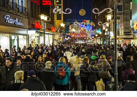 "Crowds thronging between stores and Christmas market stalls, pedestrian street in the centre of Essen, Kettwiger Strasse, Essen, North Rhine-Westphalia, Germany, Europe" View Large Photo Image Stock Photography - "Crowds thronging between stores and Christmas market stalls, pedestrian street in the centre of Essen, Kettwiger Strasse, Essen, North Rhine-Westphalia, Germany, Europe". Fotosearch