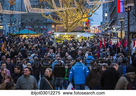 "Crowds thronging between stores and Christmas market stalls, pedestrian street in the centre of Essen, Kettwiger Strasse, Essen, North Rhine-Westphalia, Germany, Europe" View Large Photo Image Stock Photography - "Crowds thronging between stores and Christmas market stalls, pedestrian street in the centre of Essen, Kettwiger Strasse, Essen, North Rhine-Westphalia, Germany, Europe". Fotosearch