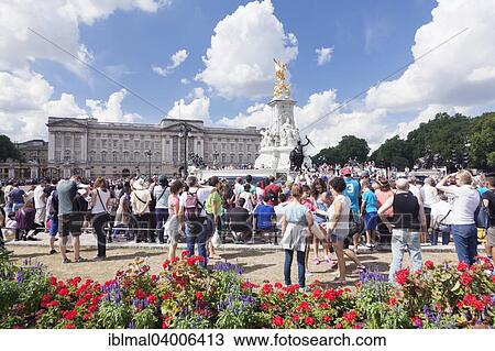 Stock Image - "Crowds waiting for the Changing of the Guard at Buckingham Palace, City of Westminster, London, England, United Kingdom, Europe". Fotosearch