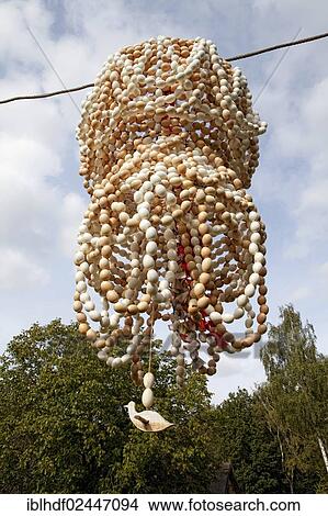 "Crown of eggs, from the shells of chicken eggs, made by batchelors, a formerly pagan fertility custom now Christianised, Whitsun, Rheinland, Germany, Europe" View Large Photo Image Picture - "Crown of eggs, from the shells of chicken eggs, made by batchelors, a formerly pagan fertility custom now Christianised, Whitsun, Rheinland, Germany, Europe". Fotosearch