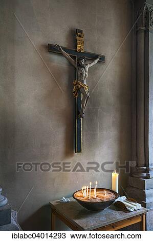 Stock Image - "Crucifix and votive candles, St. Luke's Church, Lehel, Munich, Bavaria, Germany, Europe". Fotosearch