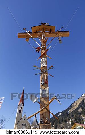 Stock Photography - "Crucifix in front of the Parish Church, Elbigenalp, Lech Valley, Tyrol, Austria, Europe". Fotosearch