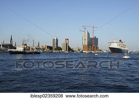 "Cruise liner RMS Queen Mary 2 leaving the harbour, steam icebreaker """"Stettin"""", left, Hamburg Cruise Days, Port of Hamburg with the Elbe Philharmonic Hall under construction at back, Hamburg, Hamburg, Germany, Europe" View Large Photo Image Stock Photo - "Cruise liner RMS Queen Mary 2 leaving the harbour, steam icebreaker """"Stettin"""", left, Hamburg Cruise Days, Port of Hamburg with the Elbe Philharmonic Hall under construction at back, Hamburg, Hamburg, Germany, Europe". Fotosearch