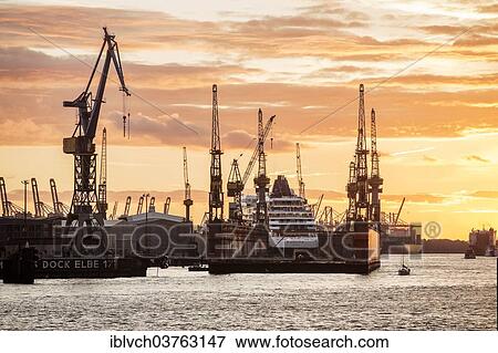 "Cruise ship in a dry dock at sunset, Port of Hamburg, Hamburg, Hamburg, Germany, Europe" View Large Photo Image Stock Photo - "Cruise ship in a dry dock at sunset, Port of Hamburg, Hamburg, Hamburg, Germany, Europe". Fotosearch