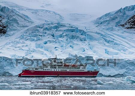 Stock Photo - "Cruise ship in the Antarctic ice, Enterprise Island, Antarctica". Fotosearch