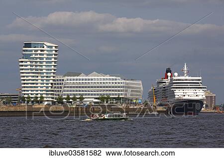 Stock Image - "Cruise ship Queen Elizabeth in the Port of Hamburg, next to Marco Polo Tower and Unilever House, HafenCity, Hamburg, Hamburg, Germany, Europe". Fotosearch
