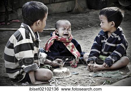 "Crying baby and two boys in Laos, Southeast Asia, Asia" View Large Photo Image Stock Photograph - "Crying baby and two boys in Laos, Southeast Asia, Asia". Fotosearch