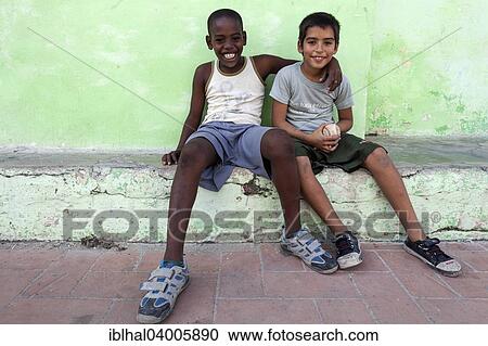 "Cuban boys in Plaza San Juan de Dios, friends, Camaguey, Cuba, North America" View Large Photo Image Stock Image - "Cuban boys in Plaza San Juan de Dios, friends, Camaguey, Cuba, North America". Fotosearch