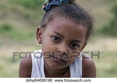 Stock Image - "Cuban girl, portrait, near Santiago de Cuba, Cuba, North America". Fotosearch