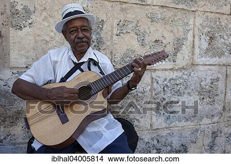 "Cuban street musician playing the guitar in Old Havana, Havana, Cuba, North America" View Large Photo Image Picture - "Cuban street musician playing the guitar in Old Havana, Havana, Cuba, North America". Fotosearch