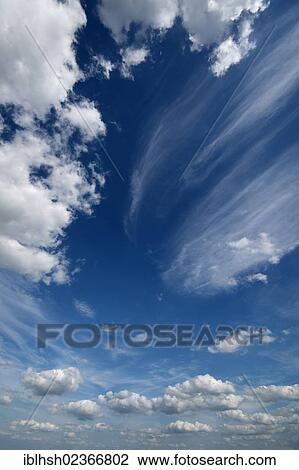 Cumulus and cirrus clouds in the sky View Large Photo Image Stock Image - Cumulus and cirrus clouds in the sky. Fotosearch