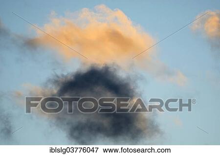 "Cumulus clouds in the evening light, one black cloud" View Large Photo Image Stock Photo - "Cumulus clouds in the evening light, one black cloud". Fotosearch