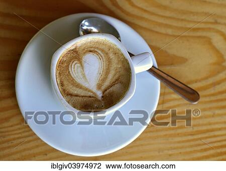 Cup of cappuccino with milk foam in a heart shape View Large Photo Image Stock Image - Cup of cappuccino with milk foam in a heart shape. Fotosearch