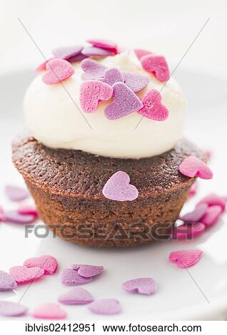 Cupcake covered with heart-shaped sprinkles View Large Photo Image Stock Image - Cupcake covered with heart-shaped sprinkles. Fotosearch
