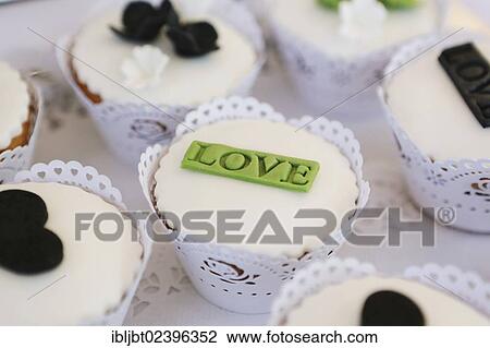 "Cupcakes, cupcake, lettering """"Love"""" at a wedding" View Large Photo Image Stock Image - "Cupcakes, cupcake, lettering """"Love"""" at a wedding". Fotosearch