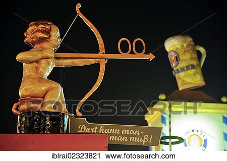 "Cupid with bow and arrow pointing towards the toilet, Oktoberfest festival, Munich, Upper Bavaria, Bavaria, Germany, Europe" View Large Photo Image Stock Image - "Cupid with bow and arrow pointing towards the toilet, Oktoberfest festival, Munich, Upper Bavaria, Bavaria, Germany, Europe". Fotosearch