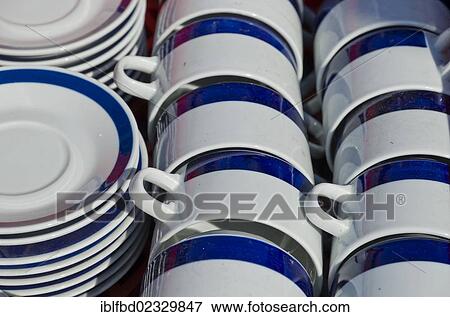"Cups and plates for sale at the weekly flea market, Dresden, Saxony, Germany, Europe" View Large Photo Image Stock Photo - "Cups and plates for sale at the weekly flea market, Dresden, Saxony, Germany, Europe". Fotosearch