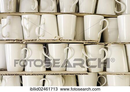 Cups piled between cardboard View Large Photo Image Stock Image - Cups piled between cardboard. Fotosearch