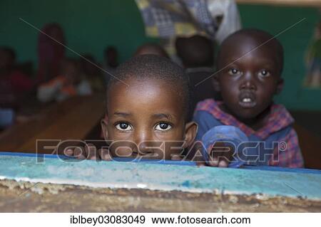 "Curious school children looking out the window in a small school on the outskirts of Musanze, Musanze, Nordprovinz, Rwanda, Africa" View Large Photo Image Stock Photo - "Curious school children looking out the window in a small school on the outskirts of Musanze, Musanze, Nordprovinz, Rwanda, Africa". Fotosearch