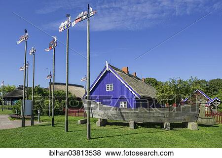 "Curonian flags in front of traditional wooden houses, Nida, KlaipÄ—da County, Lithuania, Europe" View Large Photo Image Stock Photo - "Curonian flags in front of traditional wooden houses, Nida, KlaipÄ—da County, Lithuania, Europe". Fotosearch
