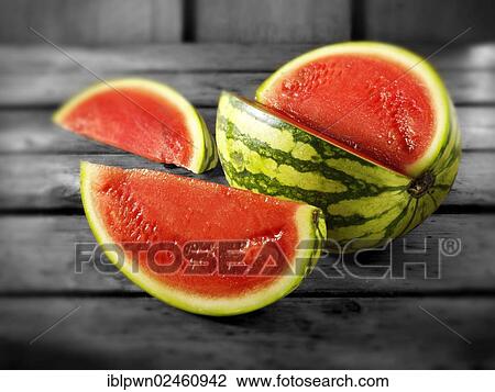 Stock Image - Cut baby red water melon. Fotosearch