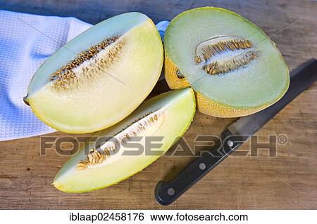Cut organic honey melon View Large Photo Image Stock Photograph - Cut organic honey melon. Fotosearch