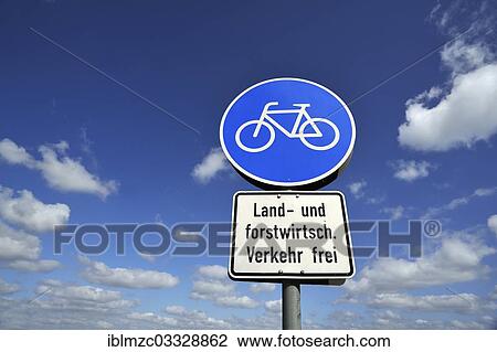 Stock Image - "Cycling path, road sign against a blue sky with clouds, Sietow, Mecklenburg-Western Pomerania, Germany, Europe". Fotosearch