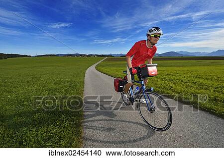 "Cyclist at Schalkham, Trumer Lakes Route, Salzburg Lake District, Salzburg State, Austria, Europe" View Large Photo Image Stock Image - "Cyclist at Schalkham, Trumer Lakes Route, Salzburg Lake District, Salzburg State, Austria, Europe". Fotosearch