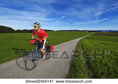 "Cyclist at Schalkham, Trumer Lakes Route, Salzburg Lake District, Salzburg State, Austria, Europe" View Large Photo Image Stock Photo - "Cyclist at Schalkham, Trumer Lakes Route, Salzburg Lake District, Salzburg State, Austria, Europe". Fotosearch
