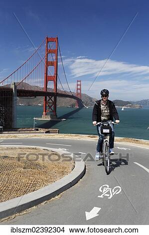 "Cyclist, Golden Gate Bridge at the back, San Francisco, California, USA" View Large Photo Image Picture - "Cyclist, Golden Gate Bridge at the back, San Francisco, California, USA". Fotosearch