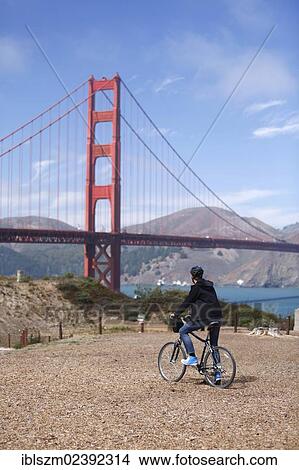 "Cyclist, Golden Gate Bridge at the back, San Francisco, California, USA" View Large Photo Image Picture - "Cyclist, Golden Gate Bridge at the back, San Francisco, California, USA". Fotosearch