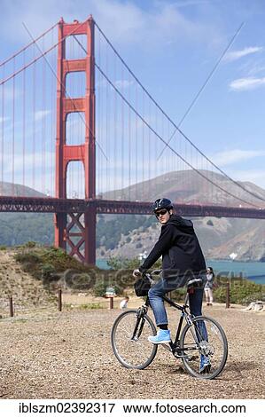 "Cyclist, Golden Gate Bridge at the back, San Francisco, California, USA" View Large Photo Image Stock Photo - "Cyclist, Golden Gate Bridge at the back, San Francisco, California, USA". Fotosearch