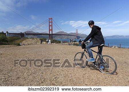 "Cyclist, Golden Gate Bridge at the back, San Francisco, California, USA" View Large Photo Image Stock Photo - "Cyclist, Golden Gate Bridge at the back, San Francisco, California, USA". Fotosearch