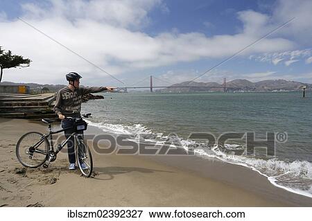 "Cyclist, Golden Gate Bridge at the back, San Francisco, California, USA" View Large Photo Image Stock Photo - "Cyclist, Golden Gate Bridge at the back, San Francisco, California, USA". Fotosearch
