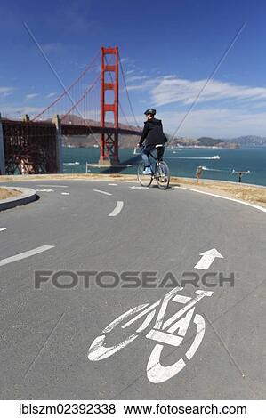 "Cyclist, Golden Gate Bridge at the back, San Francisco, California, USA" View Large Photo Image Stock Photo - "Cyclist, Golden Gate Bridge at the back, San Francisco, California, USA". Fotosearch