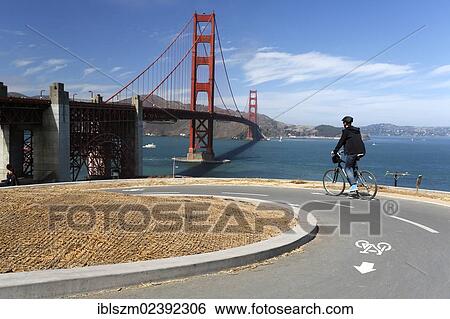 "Cyclist, Golden Gate Bridge at the back, San Francisco, California, USA" View Large Photo Image Stock Photograph - "Cyclist, Golden Gate Bridge at the back, San Francisco, California, USA". Fotosearch