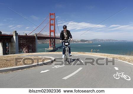 "Cyclist, Golden Gate Bridge at the back, San Francisco, California, USA" View Large Photo Image Stock Photograph - "Cyclist, Golden Gate Bridge at the back, San Francisco, California, USA". Fotosearch