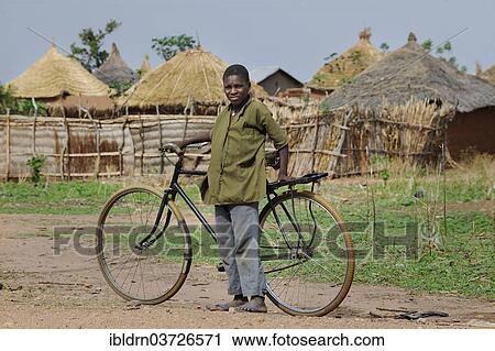 "Cyclist in a village, Garoua, North Region, Cameroon, Africa" View Large Photo Image Stock Image - "Cyclist in a village, Garoua, North Region, Cameroon, Africa". Fotosearch