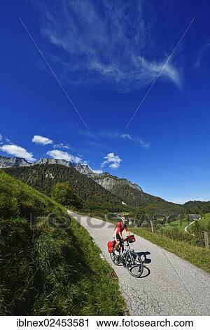 "Cyclist in the Untersberg massif, Marktschellenberg, Berchtesgaden, Upper Bavaria, Bavaria, Germany, Europe" View Large Photo Image Stock Image - "Cyclist in the Untersberg massif, Marktschellenberg, Berchtesgaden, Upper Bavaria, Bavaria, Germany, Europe". Fotosearch