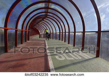 "Cyclist is riding on a Scottish Exhibition and Conference Centre Footbridge, Glasgow, Scotland, United Kingdom, Europe" View Large Photo Image Stock Photography - "Cyclist is riding on a Scottish Exhibition and Conference Centre Footbridge, Glasgow, Scotland, United Kingdom, Europe". Fotosearch