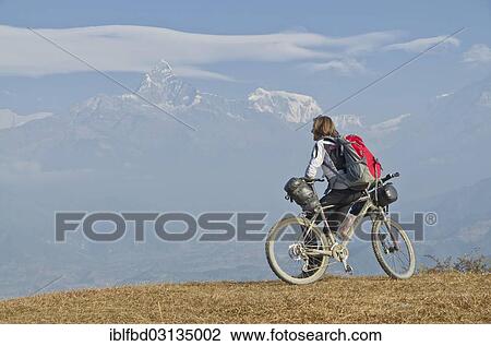 "Cyclist leaning on his bike, looking towards Annapurna range, Sarankot, Annapurna Region, Nepal, Asia" View Large Photo Image Stock Image - "Cyclist leaning on his bike, looking towards Annapurna range, Sarankot, Annapurna Region, Nepal, Asia". Fotosearch