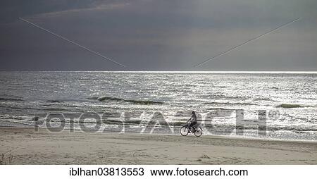 "Cyclist on the sandy beach on the Baltic Sea, Verbelnieki, Nica, Latvia, Europe" View Large Photo Image Stock Image - "Cyclist on the sandy beach on the Baltic Sea, Verbelnieki, Nica, Latvia, Europe". Fotosearch