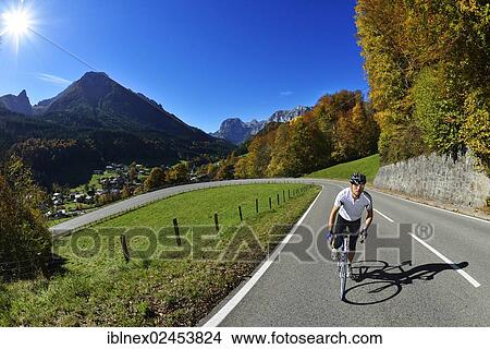 "Cyclist riding along the Hochalpenstrasse, a high alpine road between Bischofswiesen and Berchtesgaden, Upper Bavaria, Bavaria, Germany, Europe" View Large Photo Image Picture - "Cyclist riding along the Hochalpenstrasse, a high alpine road between Bischofswiesen and Berchtesgaden, Upper Bavaria, Bavaria, Germany, Europe". Fotosearch