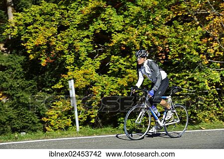 "Cyclist riding along the Obersalzbergstrasse, Berchtesgaden, Upper Bavaria, Bavaria, Germany, Europe" View Large Photo Image Stock Image - "Cyclist riding along the Obersalzbergstrasse, Berchtesgaden, Upper Bavaria, Bavaria, Germany, Europe". Fotosearch