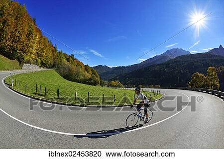 "Cyclist riding along the Hochalpenstrasse, a high alpine road between Bischofswiesen and Berchtesgaden, Upper Bavaria, Bavaria, Germany, Europe" View Large Photo Image Stock Image - "Cyclist riding along the Hochalpenstrasse, a high alpine road between Bischofswiesen and Berchtesgaden, Upper Bavaria, Bavaria, Germany, Europe". Fotosearch