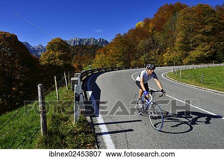 "Cyclist riding along the Hochalpenstrasse, a high alpine road between Bischofswiesen and Berchtesgaden, Upper Bavaria, Bavaria, Germany, Europe" View Large Photo Image Stock Photo - "Cyclist riding along the Hochalpenstrasse, a high alpine road between Bischofswiesen and Berchtesgaden, Upper Bavaria, Bavaria, Germany, Europe". Fotosearch