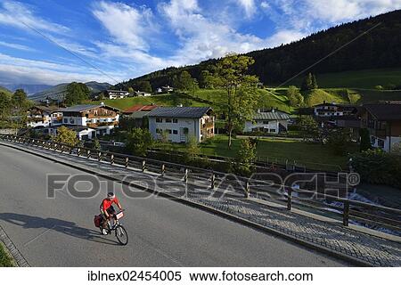 "Cyclist riding on a road, Ramsau, Berchtesgaden, Upper Bavaria, Bavaria, Germany, Europe" View Large Photo Image Stock Photography - "Cyclist riding on a road, Ramsau, Berchtesgaden, Upper Bavaria, Bavaria, Germany, Europe". Fotosearch
