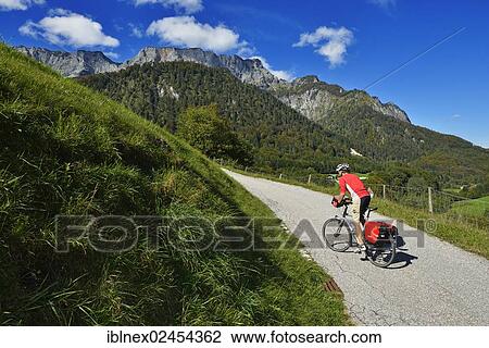 Stock Image - "Cyclist, Untersberg massif, Marktschellenberg, Berchtesgaden, Upper Bavaria, Bavaria, Germany, Europe". Fotosearch