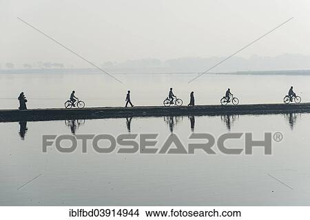 "Cyclists and pedestrians crossing the Yamuna river on a dam in the morning, Vrindavan, Uttar Pradesh, India, Asia" View Large Photo Image Picture - "Cyclists and pedestrians crossing the Yamuna river on a dam in the morning, Vrindavan, Uttar Pradesh, India, Asia". Fotosearch